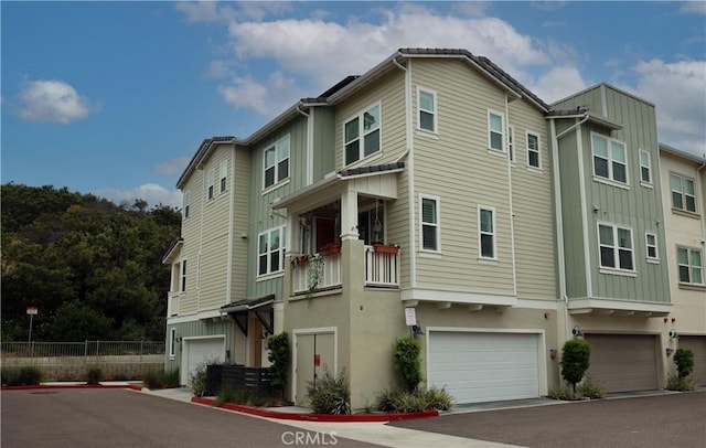 1104 Hibiscus Way, Oceanside, CA 92054 - view of home's exterior featuring board and batten siding and a garage