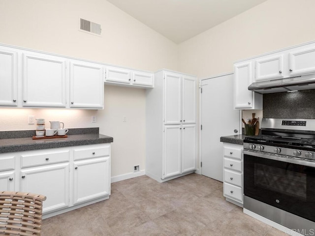 1219 Sunglow Dr, Oceanside, CA 92056 - kitchen featuring gas stove, under cabinet range hood, white cabinetry, vaulted ceiling, and dark countertops
