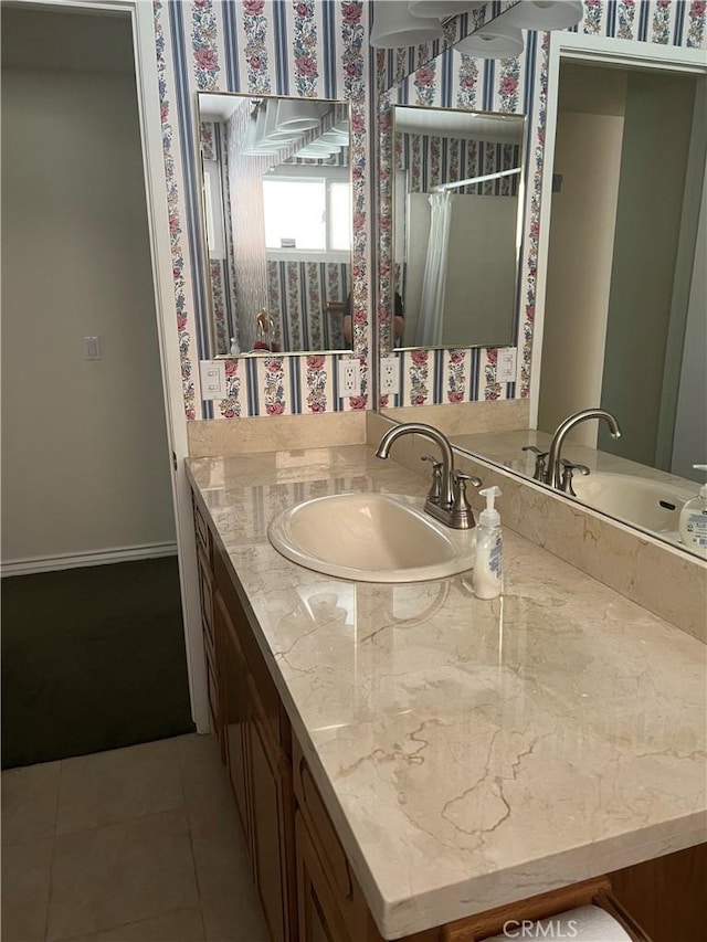 2306 S Rene Dr, Santa Ana, CA 92704 - bathroom with vanity, tile patterned floors, and wallpapered walls