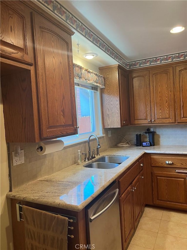 2306 S Rene Dr, Santa Ana, CA 92704 - kitchen with stainless steel dishwasher, a sink, tasteful backsplash, light tile patterned floors, and light stone countertops