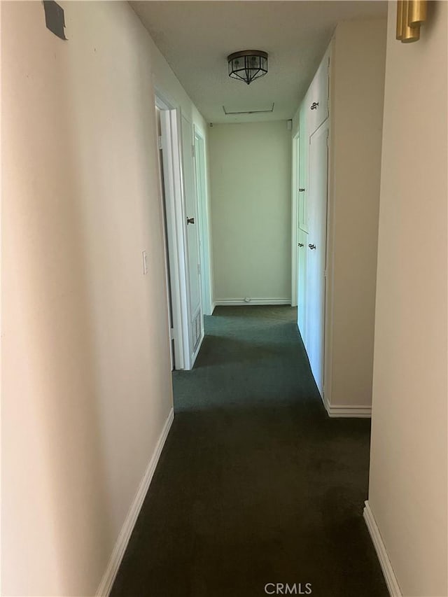 2306 S Rene Dr, Santa Ana, CA 92704 - hallway featuring dark colored carpet and baseboards