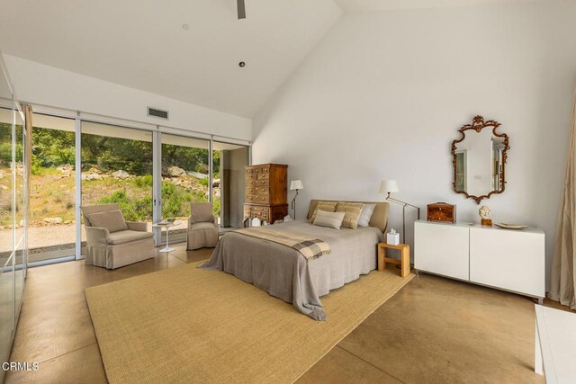 12179 Koenigstein Rd, Santa Paula, CA 93060 - bedroom featuring access to outside, high vaulted ceiling, and finished concrete flooring