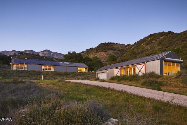 12179 Koenigstein Rd, Santa Paula, CA 93060 - view of side of home featuring metal roof, a mountain view, gravel driveway, and a standing seam roof