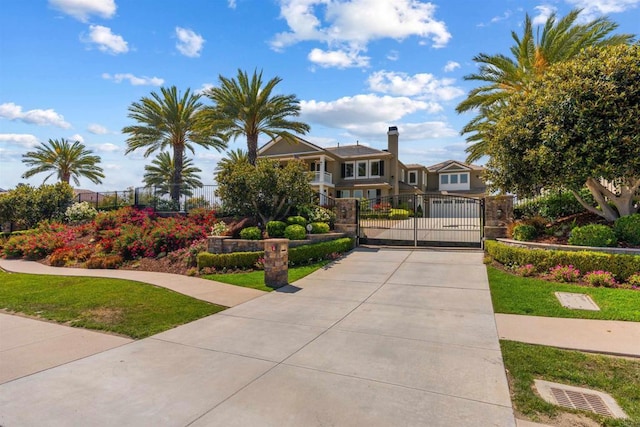 2574 Muirfields Dr, Carlsbad, CA 92009 - view of front facade featuring a gate and driveway