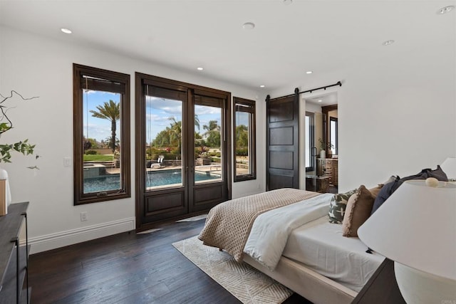 2574 Muirfields Dr, Carlsbad, CA 92009 - bedroom with a barn door, dark wood-style flooring, recessed lighting, and baseboards