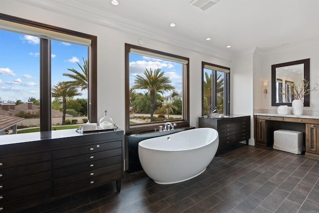 2574 Muirfields Dr, Carlsbad, CA 92009 - bathroom featuring a freestanding bath, vanity, recessed lighting, and ornamental molding