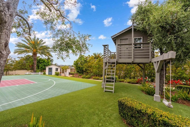2574 Muirfields Dr, Carlsbad, CA 92009 - view of green lawn featuring community basketball court and an outbuilding