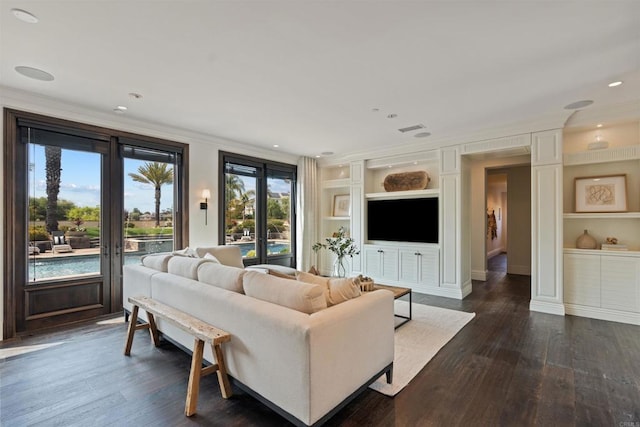 2574 Muirfields Dr, Carlsbad, CA 92009 - living room with ornamental molding, built in shelves, dark wood-style flooring, recessed lighting, and french doors