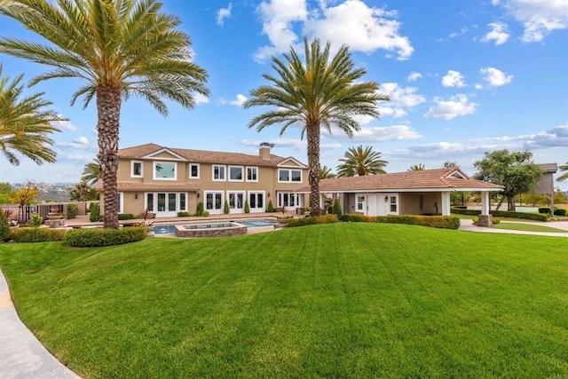 2574 Muirfields Dr, Carlsbad, CA 92009 - view of front facade with french doors, a front yard, and stucco siding