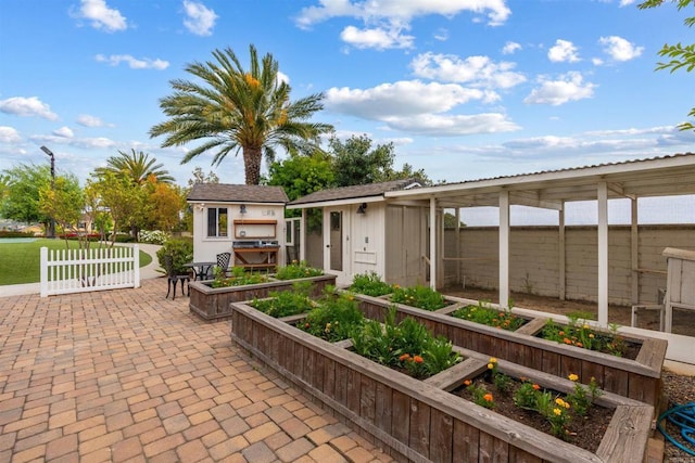 2574 Muirfields Dr, Carlsbad, CA 92009 - view of patio / terrace with a garden