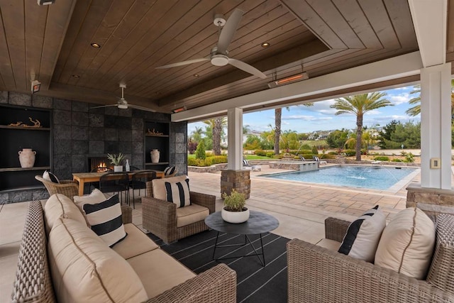 2574 Muirfields Dr, Carlsbad, CA 92009 - view of patio featuring an outdoor living space with a fireplace, a pool with connected hot tub, and a ceiling fan