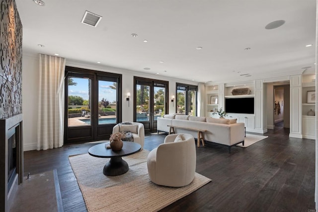 2574 Muirfields Dr, Carlsbad, CA 92009 - living area featuring a fireplace with flush hearth, baseboards, dark wood-style flooring, recessed lighting, and crown molding