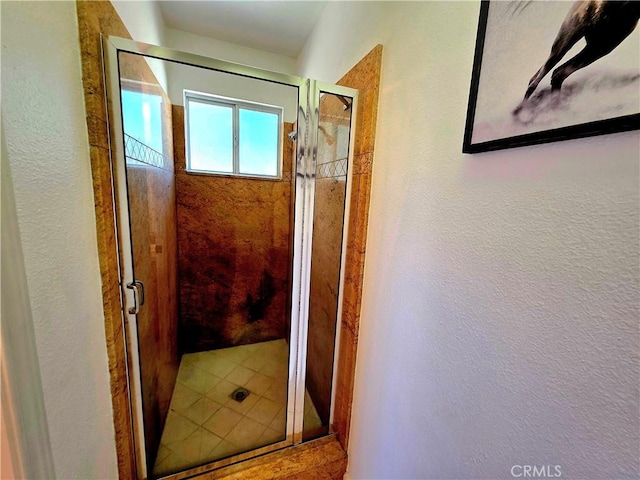 39560 S Lilley Way, Coarsegold, CA 93614 - full bathroom featuring a shower stall, a textured wall, and tile patterned floors