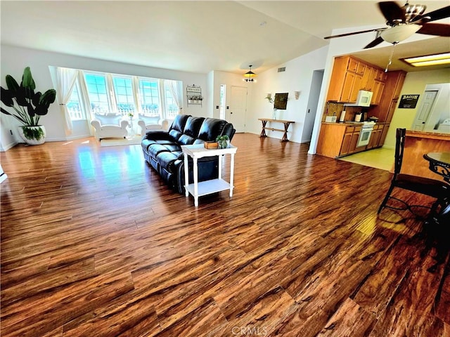 39560 S Lilley Way, Coarsegold, CA 93614 - living room featuring wood finished floors, vaulted ceiling, ceiling fan, and baseboards