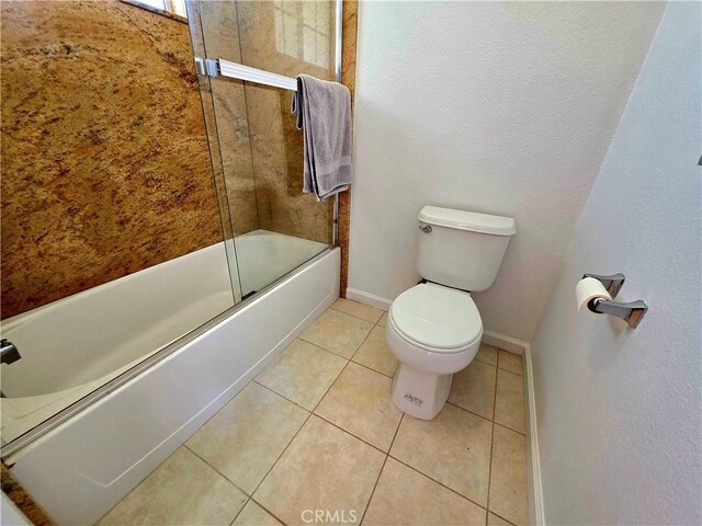 39560 S Lilley Way, Coarsegold, CA 93614 - full bathroom with toilet, shower / bath combination with glass door, baseboards, and tile patterned flooring