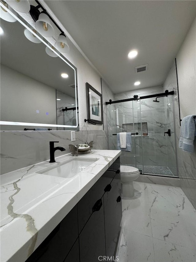 13502 Jackson St, Westminster, CA 92683 - bathroom with vanity, toilet, a marble finish shower, recessed lighting, and marble finish flooring