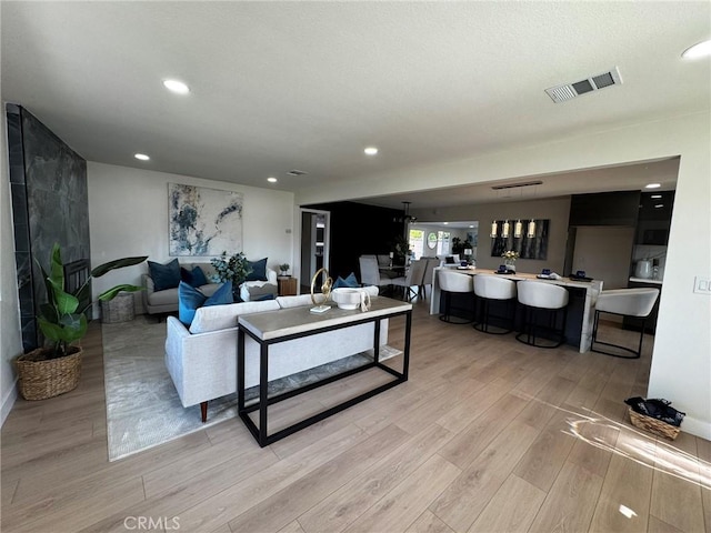 13502 Jackson St, Westminster, CA 92683 - living room featuring light wood-style flooring and recessed lighting