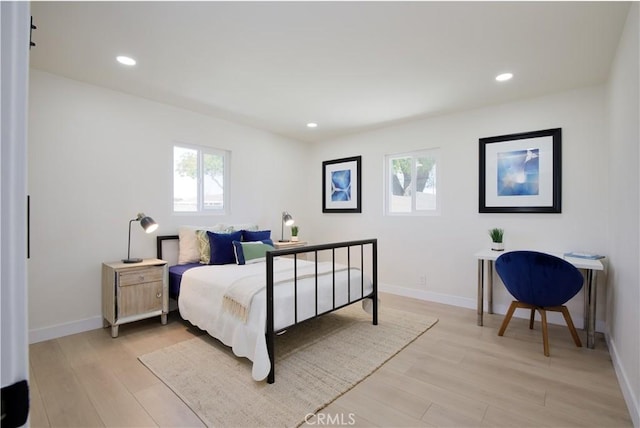 13502 Jackson St, Westminster, CA 92683 - bedroom with multiple windows, light wood-type flooring, recessed lighting, and baseboards
