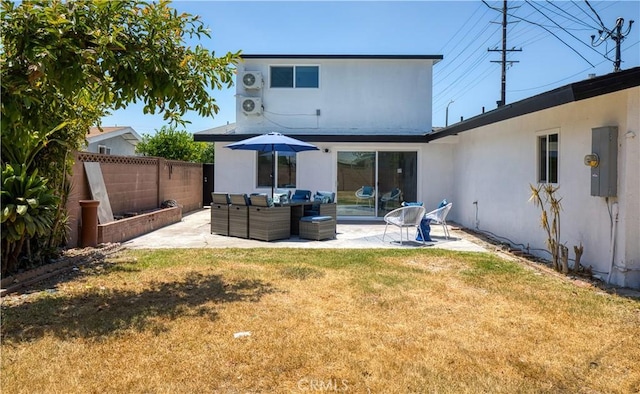 13502 Jackson St, Westminster, CA 92683 - back of property with a patio area, outdoor lounge area, stucco siding, and ac unit