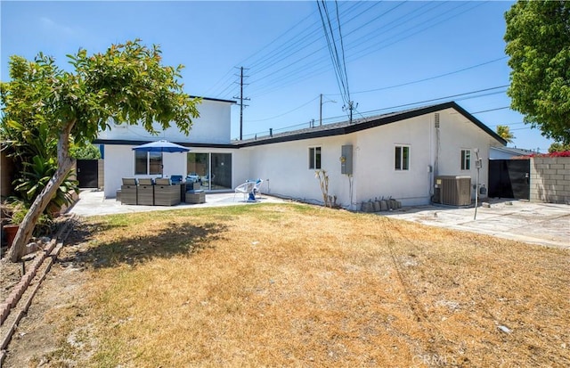 13502 Jackson St, Westminster, CA 92683 - rear view of property featuring an outdoor hangout area, a patio, central air condition unit, and stucco siding