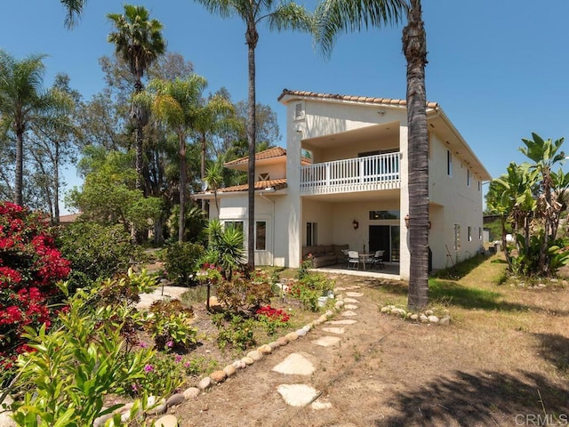 10237 High Mountain Dr, Escondido, CA 92026 - rear view of house with a balcony, a tiled roof, a patio area, and stucco siding