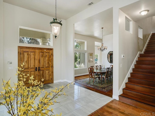 10237 High Mountain Dr, Escondido, CA 92026 - foyer entrance with stairs, a chandelier, a towering ceiling, and light tile patterned floors