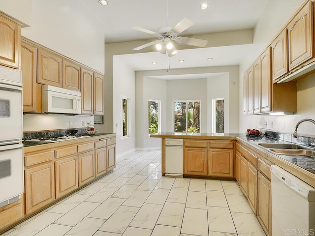 10237 High Mountain Dr, Escondido, CA 92026 - kitchen with white appliances, light marble finish floors, a peninsula, a ceiling fan, and recessed lighting