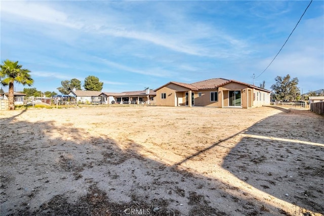 21402 Short Ridge Ave, Perris, CA 92570 - rear view of property with stucco siding and a tile roof