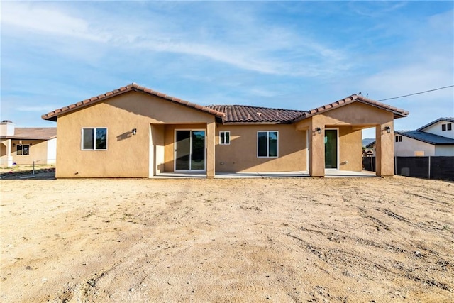 21402 Short Ridge Ave, Perris, CA 92570 - rear view of property featuring stucco siding, a tile roof, and a patio area