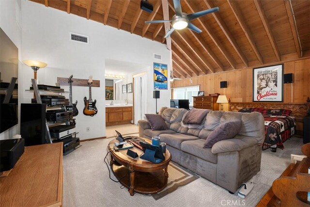 31531 Via Conejo Unit 153, Coto De Caza, CA 92679 - living area featuring light carpet, wooden ceiling with exposed beams, high vaulted ceiling, a ceiling fan, and baseboards