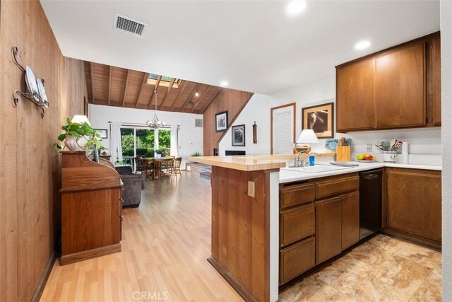 31531 Via Conejo Unit 153, Coto De Caza, CA 92679 - kitchen with dishwasher, a peninsula, a sink, light countertops, and brown cabinets