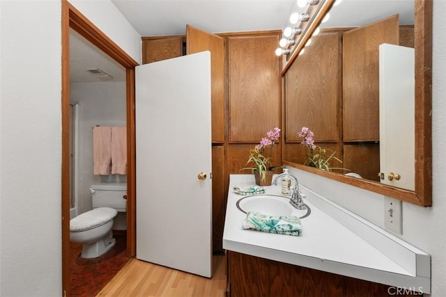 31531 Via Conejo Unit 153, Coto De Caza, CA 92679 - full bath with toilet, vanity, wood finished floors, and a shower