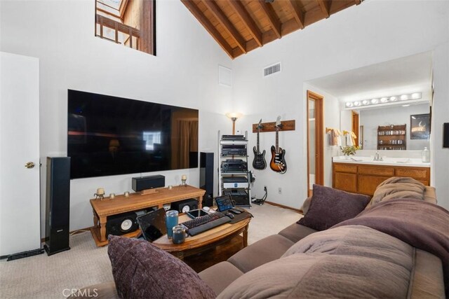 31531 Via Conejo Unit 153, Coto De Caza, CA 92679 - living area with light colored carpet, wooden ceiling with exposed beams, high vaulted ceiling, and baseboards