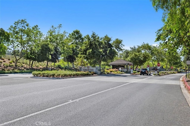 31531 Via Conejo Unit 153, Coto De Caza, CA 92679 - view of asphalt street with traffic signs and curbs