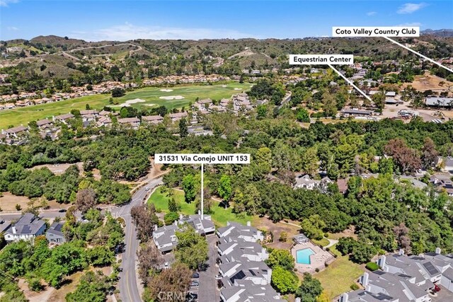 31531 Via Conejo Unit 153, Coto De Caza, CA 92679 - aerial view of property and surrounding area featuring nearby suburban area, a golf club, and a mountainous background