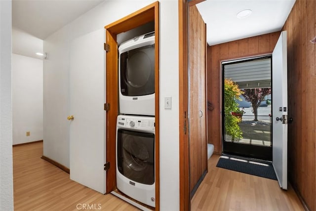 31531 Via Conejo Unit 153, Coto De Caza, CA 92679 - washroom featuring stacked washer / drying machine and light wood-type flooring