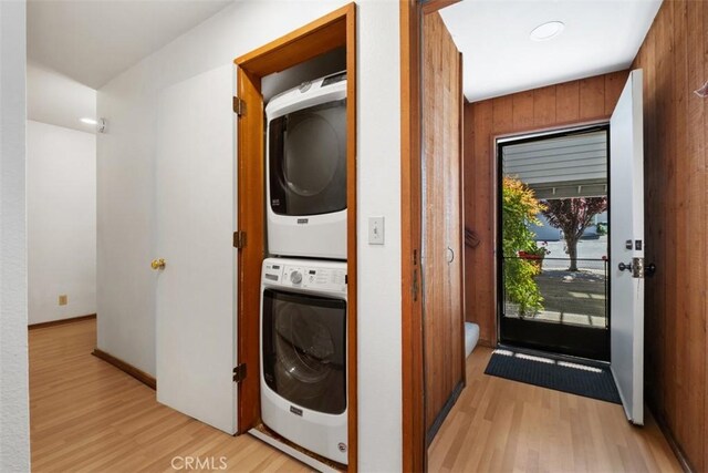 31531 Via Conejo Unit 153, Coto De Caza, CA 92679 - laundry room with estacked washer and dryer and light wood finished floors