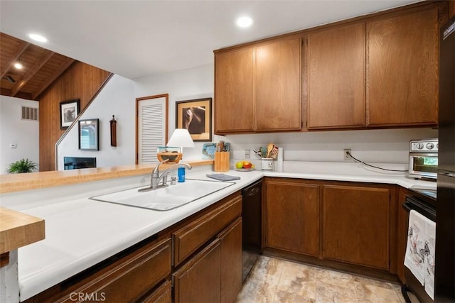 31531 Via Conejo Unit 153, Coto De Caza, CA 92679 - kitchen featuring a sink, light countertops, black dishwasher, brown cabinets, and wood ceiling