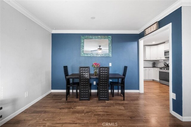 8506 Conway Dr, Riverside, CA 92504 - dining space featuring crown molding, baseboards, ceiling fan, and dark wood-style floors