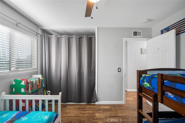 8506 Conway Dr, Riverside, CA 92504 - bedroom with wood finished floors, baseboards, and a ceiling fan