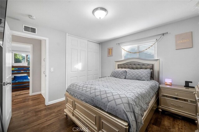 8506 Conway Dr, Riverside, CA 92504 - bedroom featuring dark wood finished floors, baseboards, and a closet