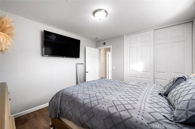 8506 Conway Dr, Riverside, CA 92504 - bedroom with baseboards, a closet, and wood finished floors