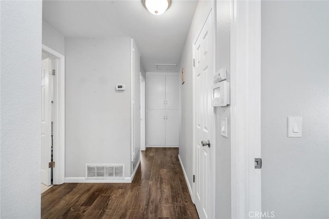 8506 Conway Dr, Riverside, CA 92504 - hall featuring wood finished floors, baseboards, and attic access