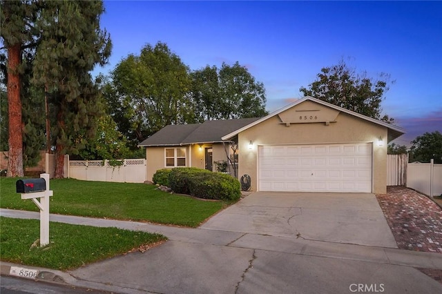 8506 Conway Dr, Riverside, CA 92504 - view of front of house featuring driveway, an attached garage, and stucco siding