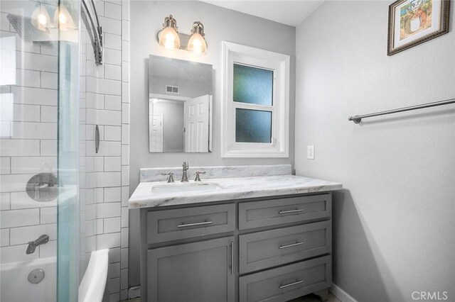 8506 Conway Dr, Riverside, CA 92504 - bathroom with vanity, baseboards, and  shower combination