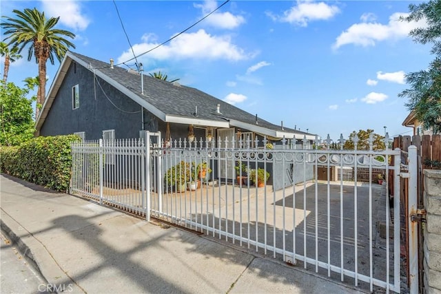 471 N Ditman Ave, Los Angeles, CA 90063 - view of front of house with roof with shingles, a fenced front yard, and a gate