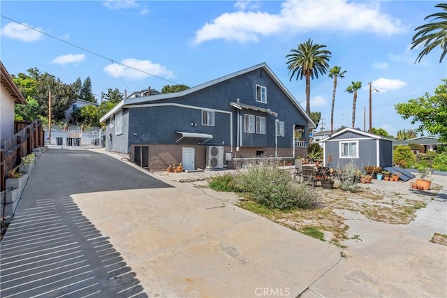 471 N Ditman Ave, Los Angeles, CA 90063 - bungalow-style house featuring stucco siding, an outdoor structure, and driveway