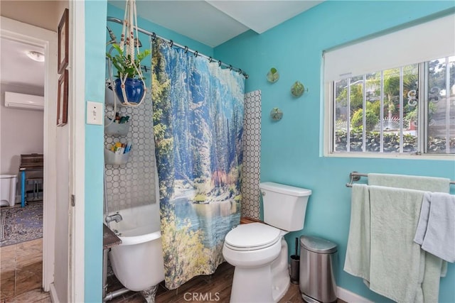 471 N Ditman Ave, Los Angeles, CA 90063 - bathroom featuring a soaking tub, an AC wall unit, toilet, curtained shower, and wood finished floors
