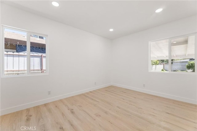 3411 N Pershing Ave, San Bernardino, CA 92405 - unfurnished room with healthy amount of natural light, light wood-style flooring, baseboards, and recessed lighting