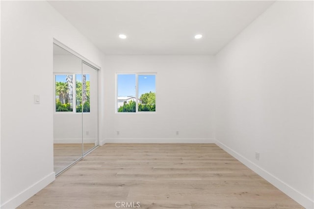 3411 N Pershing Ave, San Bernardino, CA 92405 - spare room featuring recessed lighting, light wood-type flooring, and baseboards